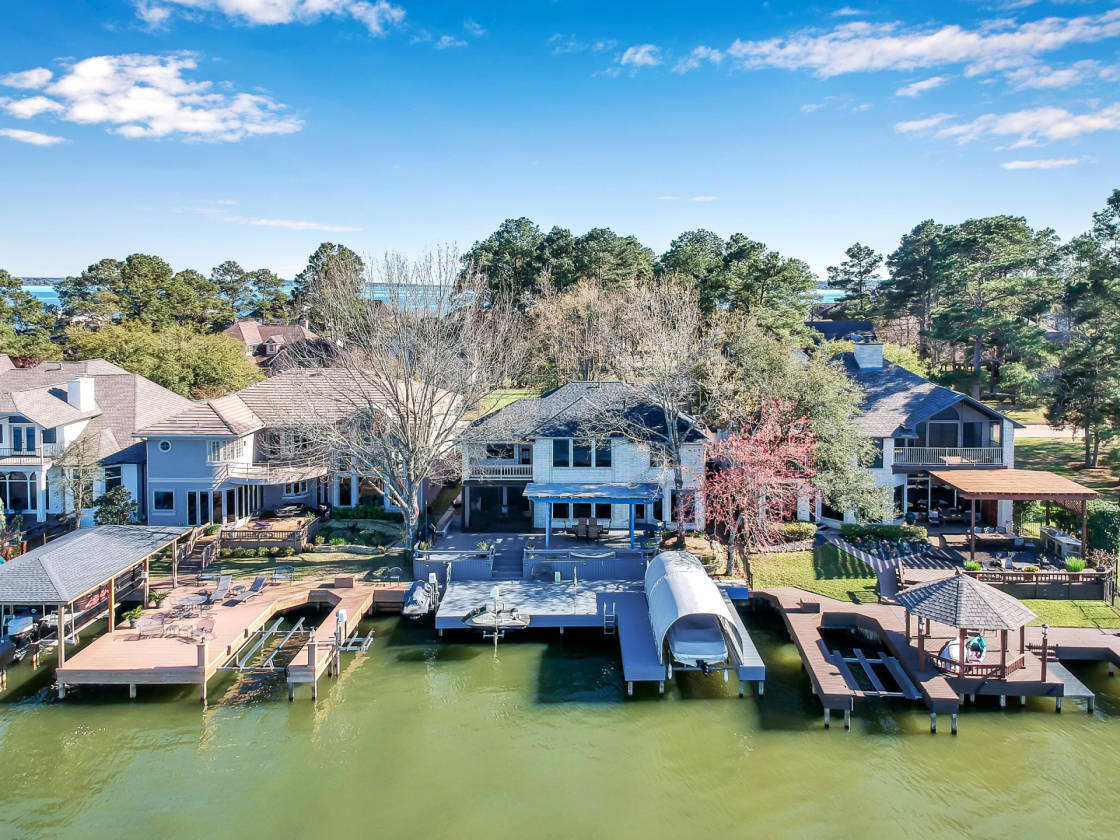 Lake Conroe updated home with open water views in country